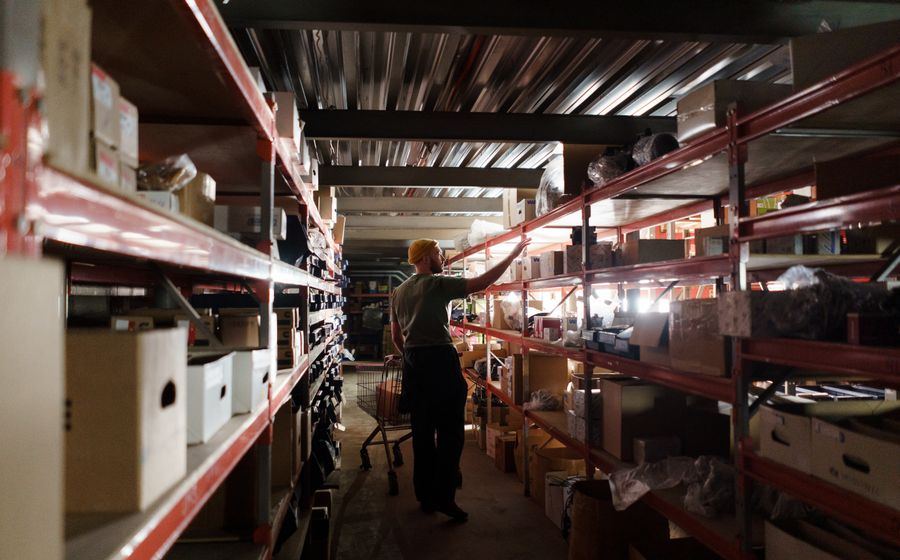 Organized warehouse shelving holding contracted inventory